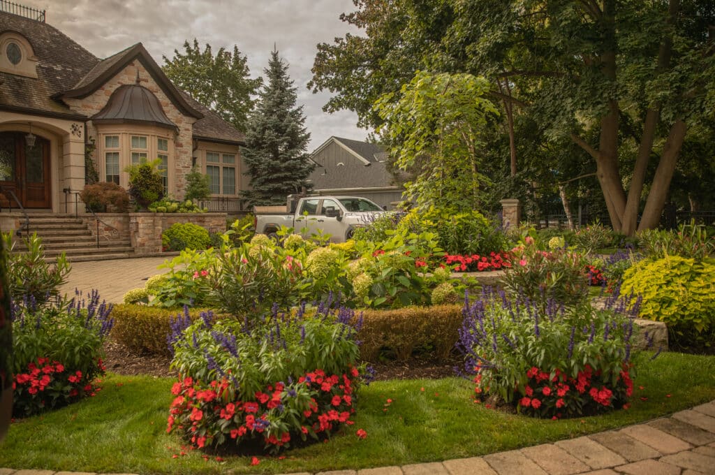 Landscaping Services in Burlington, nicely landscaped front yard with flower beds